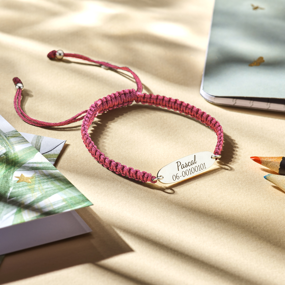 Zilveren kinderarmband met naam en telefoonnummer roze